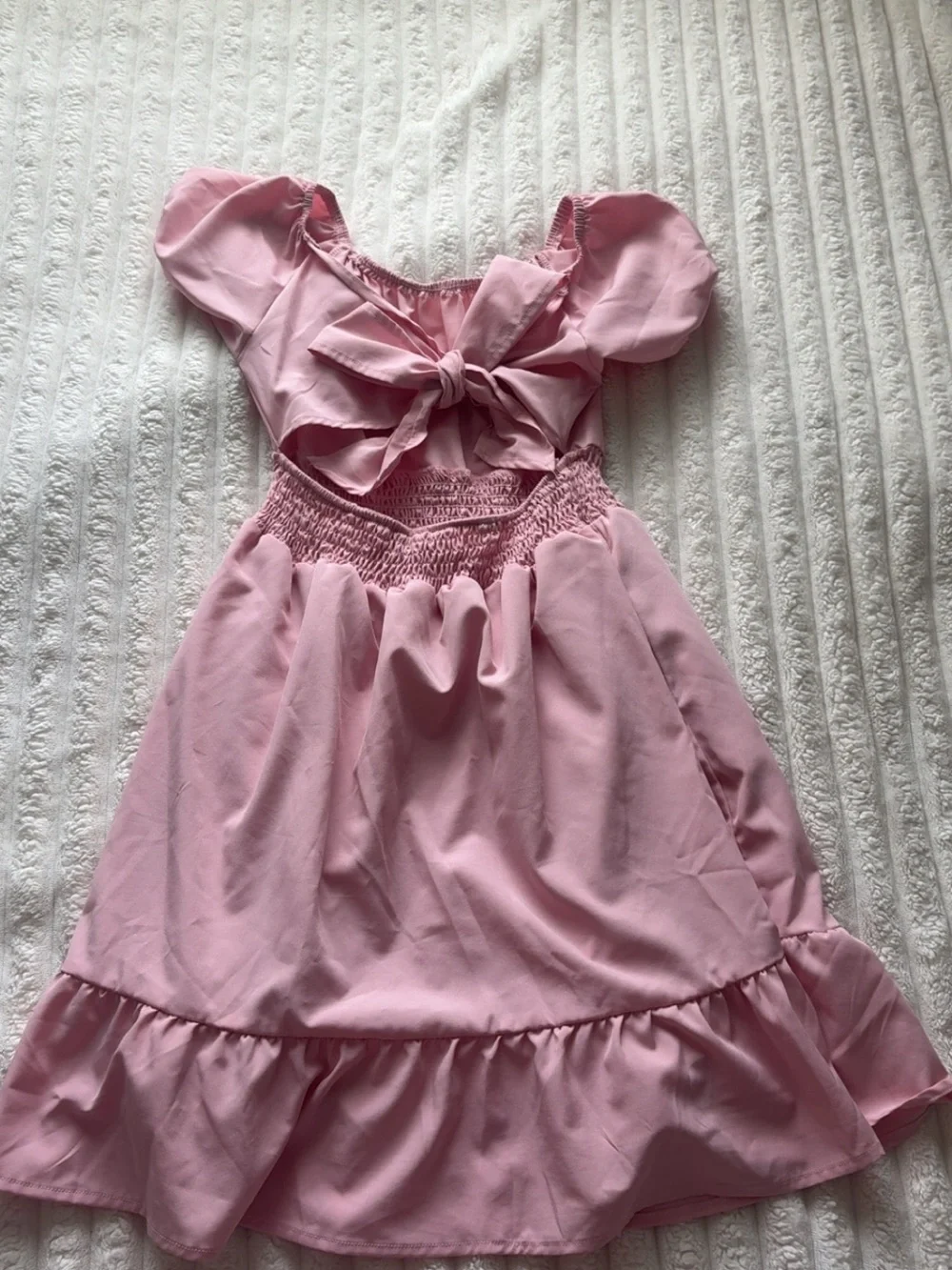 Pink babydoll dress with bow detail